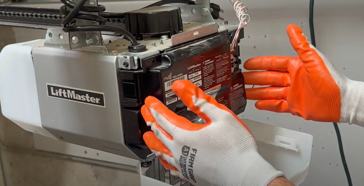 Experienced technician performing garage door opener repair services in Jupiter, FL.