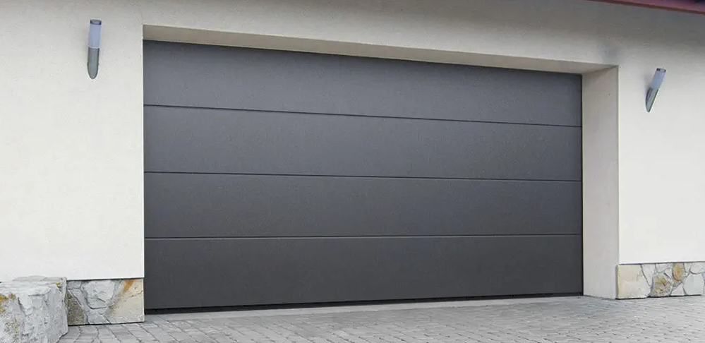 a professional technician performing a garage door installation in a residential home located in Jupiter, FL, highlighting the precision and expertise of Jupiter FL Garage Door Repair Services.