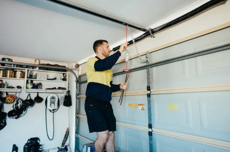 Precision Leveling for Sloped Driveway Garage Door Repair